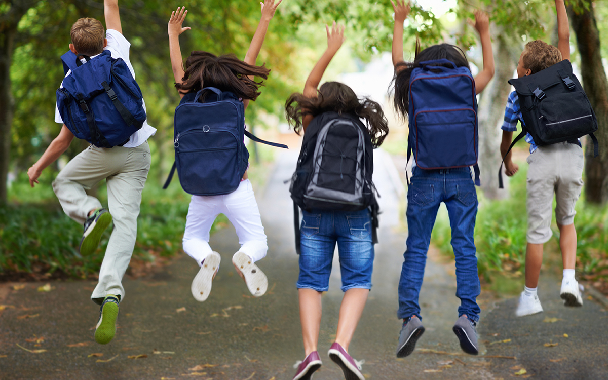 Kids-Jumping-With-Backpacks